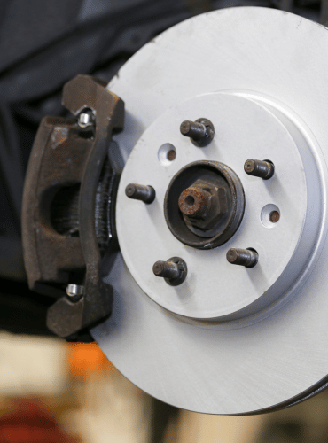 Close-up view of a car brake rotor and caliper